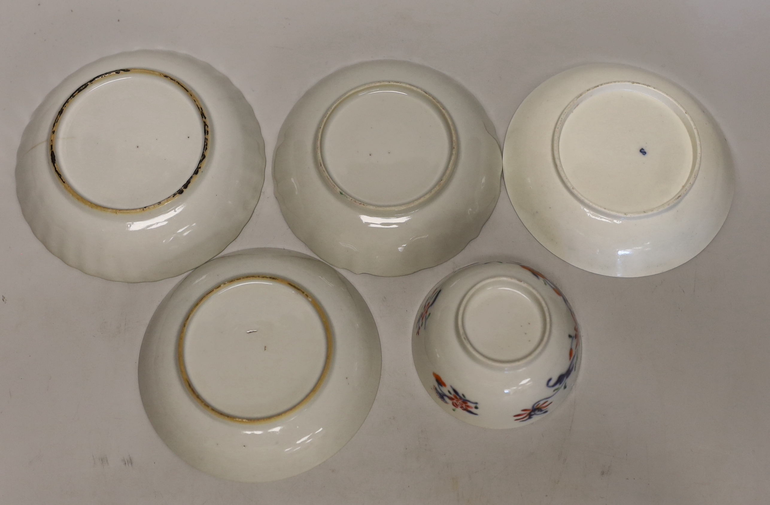 Three 18th century Chinese famille rose tea bowls and matching saucers, a Caughley teabowl and saucer and a single tea bowl and smaller tea bowl
